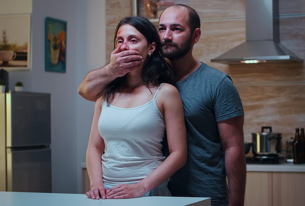 man holding woman violence